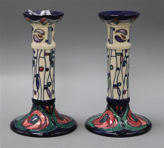 A pair of Moorcroft Mackintosh candlesticks H.21cm